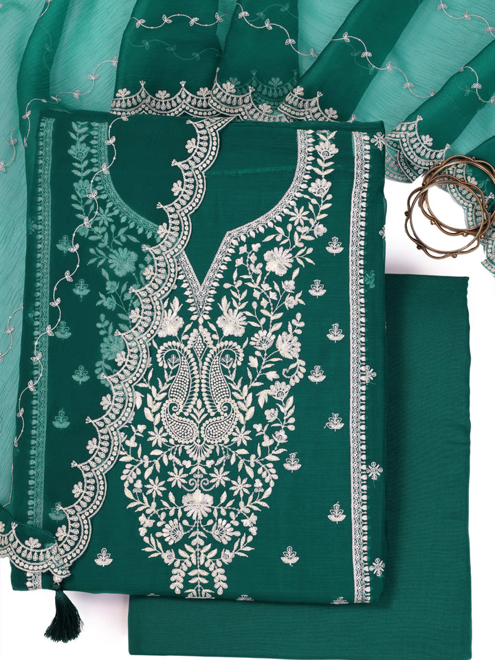 Green chiffon top with thread embroidery and tassels, unstitched salwar suit.